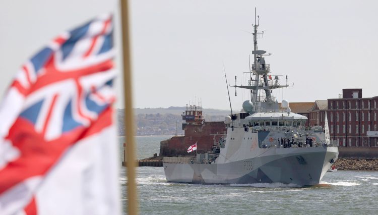 HMS Tamar returning to Portsmouth photo taken from HMS Lancaster and with her white ensign in the foreground FRPUE 20210507 BS0001 002 CREDIT Crown Copyright
